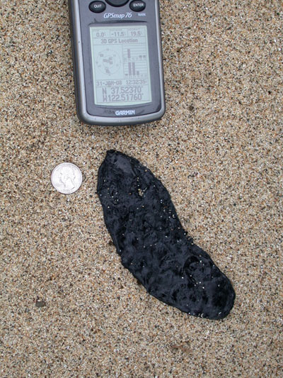 Black tar on beach Black tar on beach